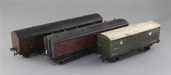 A GW Monster baggage van, no.591, in maroon, an LMS baggage van, no.37817, in maroon and a GW 16T van,